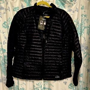 A brand new black jacket .